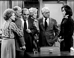 A scene from the final episode of The Mary Tyler Moore Show (from left): White as Sue Ann Nivens, Gavin MacLeod as Murray Slaughter, Ed Asner as Lou Grant, Georgia Engel as Georgette Franklin Baxter, Ted Knight as Ted Baxter, and Mary Tyler Moore as Mary Richards, 1977