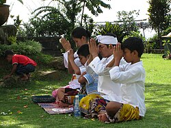 Kramaning sembah worship gesture during Hindu Balinese sembahyang at Pura Parahyangan Agung Jagatkarta