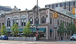 A photograph of the front and side facade of the Weinmann Block
