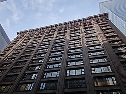 Historically unprecedented grid of wide windows, clear expression of structural frame, and minimalist ornamentation on the Marquette Building (1895).