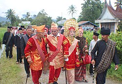Two Datuks, Minangkabau tribal or village leader, are chatting among the preparation of cultural ceremony called Batagak Datuak or Batagak Penghulu (Inauguration of the Leader) in District of Kamang Magek, Agam, West Sumatra.