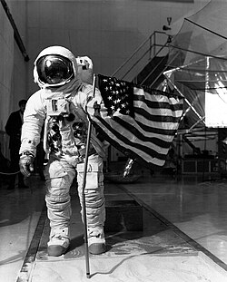 Lovell practices deploying the flag