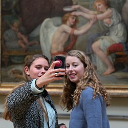 Two young women taking a selfie at the Palais des Beaux-Arts in Lille, France (2016)