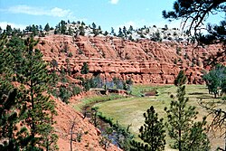 Red sandstone cliffs in the Black Hills Wyoming, former Kiowa territory which remains a sacred area to them in modern times.