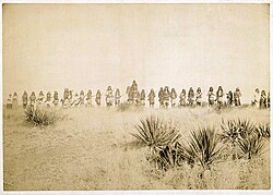 "Scene in Geronimo's camp, the Apache outlaw. Taken before the surrender to Gen. Crook, March 27, 1886, in the Sierra Madre mountains of Mexico, escaped March 30, 1886."
