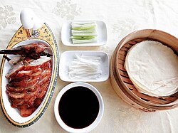 Sliced Peking duck served with traditional condiments
