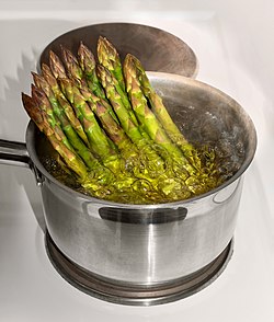 Boiling asparagus in a pot
