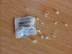 Silica gel, as beads packed in a permeable bag, is a commonly used desiccant.
