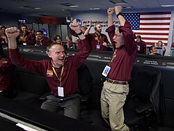 NASA team cheers as the InSight Lander touches down on Mars. (26 November 2018).[16]