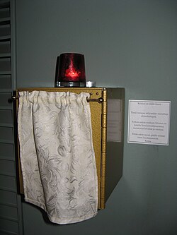 A tabernacle at Mikael Agricola Lutheran Church in Helsinki, juxtaposed with a chancel lamp and note about the real presence