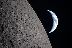 Mission specialist Christina Koch experienced the overview effect in the 2026 Artemis II flight circumnavigating the moon—photo shown here—Koch saying, "every single person that you know is sustained and inside of that green line" of the Earth's atmosphere.[16]