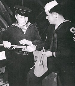 A Soviet Navy signalman (left) receives training from a U.S. Navy signalman at Cold Bay in 1945.[12]