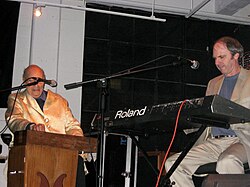 Perrey playing a Ondioline and Countryman playing a Roland synthesizer