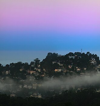 Earth's shadow (blue) and the Belt of Venus (pink) at dawn, seen above the Pacific Ocean (blue-grey), looking west from Twin Peaks, San Francisco