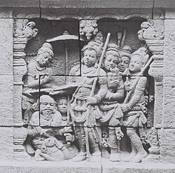 A nobleman accompanied by his entourage and servants, a bas-relief of Borobudur