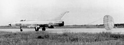 A missile-armed VPAF MiG-21PF landing using the parachute