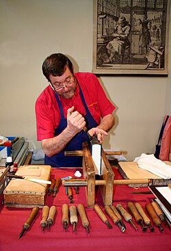 A traditional bookbinder at work