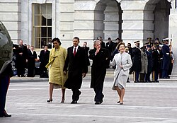 Former president George W. Bush and his wife being escorted to a waiting helicopter by President Barack Obama and First Lady Michelle Obama on January 20, 2009