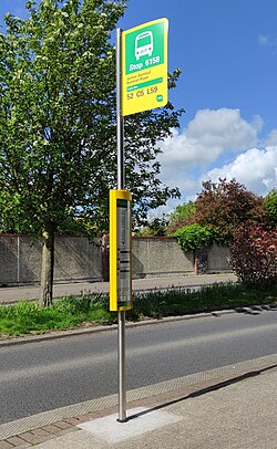 Bus stop pole in Dublin, Ireland, with various information