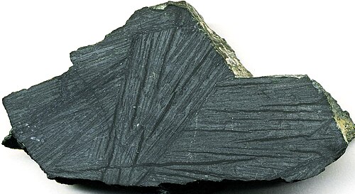 Archean komatiite from the Komati Formation in the Komati River Valley, South Africa, showcasing spinifex texture.