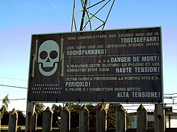 Sign on a fence around the Beromünster Reserve Broadcasting Tower in Switzerland, warning of high voltage and danger of death