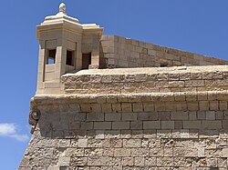 A watchtower of Fort Saint Elmo, Malta showing several stages of sandstone weathering and restoration