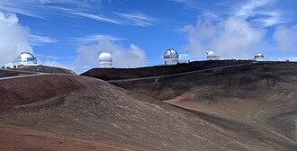 Telescopes atop Mauna Kea. The Kuiper belt was discovered with UH88, which is the fourth from the left.