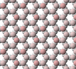 View of tetrahedral sheet structure of a clay mineral. Apical oxygen ions are tinted pink.