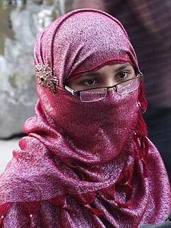 A Bengali Muslim woman wearing a pink niqab