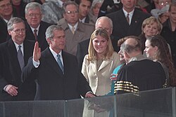 Bush takes the oath of office administered by Chief Justice William Rehnquist at the Capitol on January 20, 2001
