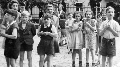Photo taken by Maurice Rossel at choreographed Theresienstadt visit. Most of the children were murdered at Auschwitz in the fall of 1944.[16]