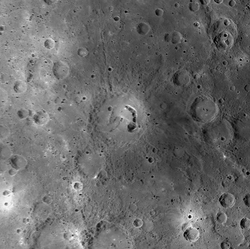 The arc-shaped pit on the eastern side of Picasso crater may have formed from the collapse of a magma tube