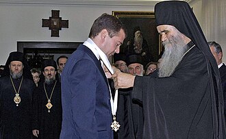 Dmitry Medvedev receives the Order of St. Sava from Metropolitan Amfilohije.