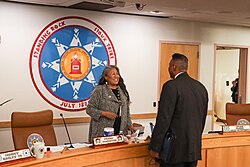 Chairwoman Janet Alkire speaks to Under Secretary of Agriculture for Rural Development Basil Gooden in 2024.