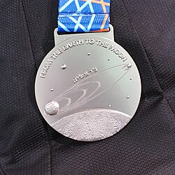 Trajectory on a silver medal of the 2019 International Physics Olympiad