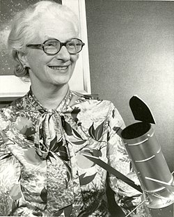 Nancy Grace Roman with a model of the Large Space Telescope that was eventually developed as the Hubble Space Telescope. While listed as a 1966 photo, this design was not the standard until the mid-1970s.