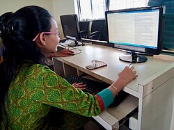 A student doing proof reading during her project at New Law College in Pune, India