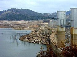 The dam wall and reservoir, during a period of sustained drought, 2003