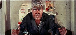 Jonathan Winters crashes through a wall in It's a Mad, Mad, Mad, Mad World (1963)