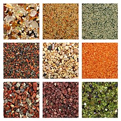 Global collage of sand samples. There is one square centimeter of sand on every sample photo. Sand samples row by row from left to right: 1. Glass sand from Kauai, Hawaii 2. Dune sand from the Gobi Desert 3. Quartz sand with green glauconite from Estonia 4. Volcanic sand with reddish weathered basalt from Maui, Hawaii 5. Biogenic coral sand from Molokai, Hawaii 6. Coral pink sand dunes from Utah 7. Volcanic glass sand from California 8. Garnet sand from Emerald Creek, Idaho 9. Olivine sand from Papakolea, Hawaii.