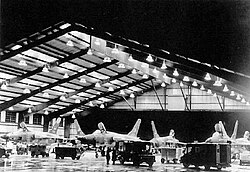 34th TFS F-105D Thunderchiefs of the 388th TFW undergo nighttime maintenance inside the big hangar at Korat in 1968. The large hangar sheltered the aircraft and its ground crews from intense tropical sunshine and heavy rains.