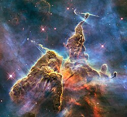 A pillar of gas and dust in the Carina Nebula. This Wide Field Camera 3 image, dubbed Mystic Mountain, was released in 2010 to commemorate Hubble's 20th anniversary in space.
