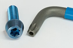 A security Torx L-key and fastener with holes for a safety pin to hinder disassembly with an ordinary Torx key.