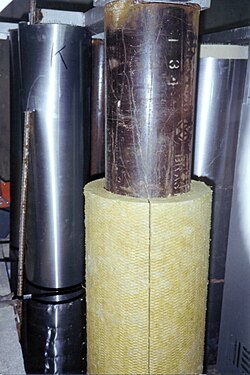 Mineral wool pipe covering applied to a steel pipe for a fire test