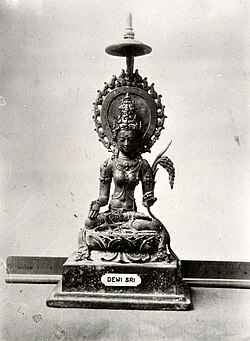 Ancient statue of the rice goddess Dewi Sri[133][134] from Java (c. 9th century)