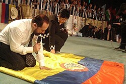 Pentecostal pastors pray over the Colombian flag.