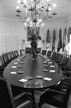 Photograph of Ford dancing on the table of the Cabinet Room