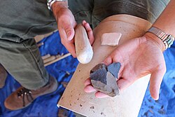 Flintknapping a stone tool