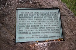 A 1960 plaque dedicated to David Hudson and his party by the Hudson Library and Historical Society, marking a plot of land that was set aside in 1805 to be used as a public square.
