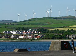 Wind turbines overlooking Ardrossan in Scotland. The UK is a major producer of wind energy in Europe.[330]